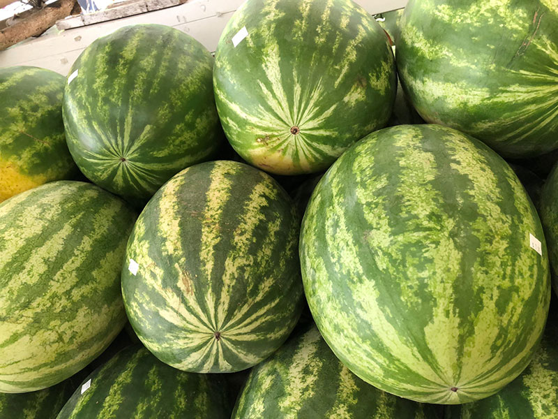 Watermelons stacked at a market